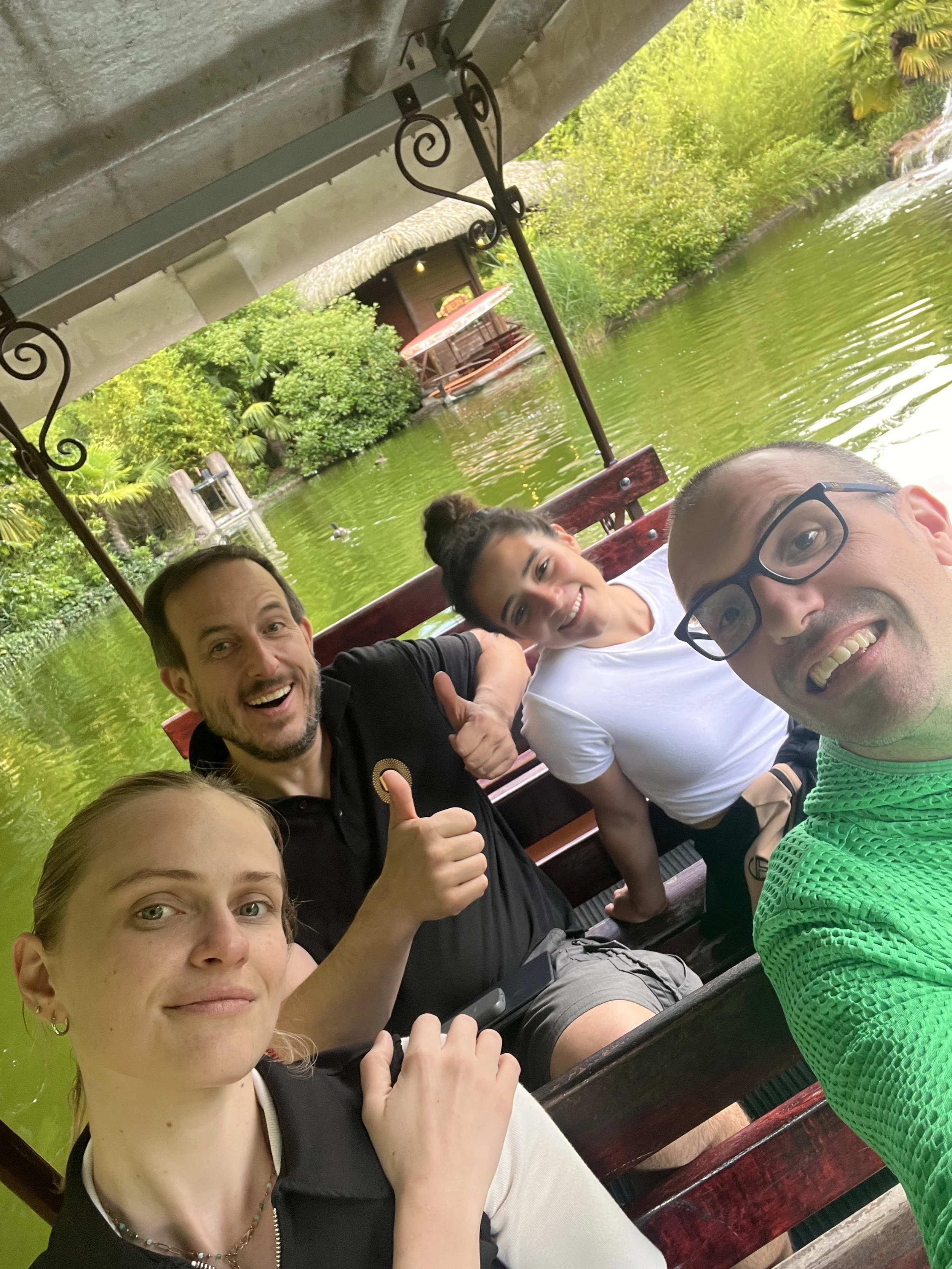Sara Cáceres, Yulia Protasova, Heiko Kraft, and Gerard Pastor in a savanna setting, smiling at the camera.