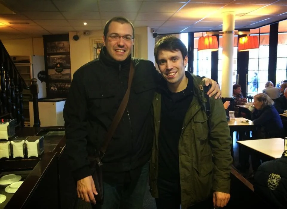 Gerard Pastor and Ferran Cullell standing and looking at the camera in a photograph taken at Café Zurich in Barcelona.